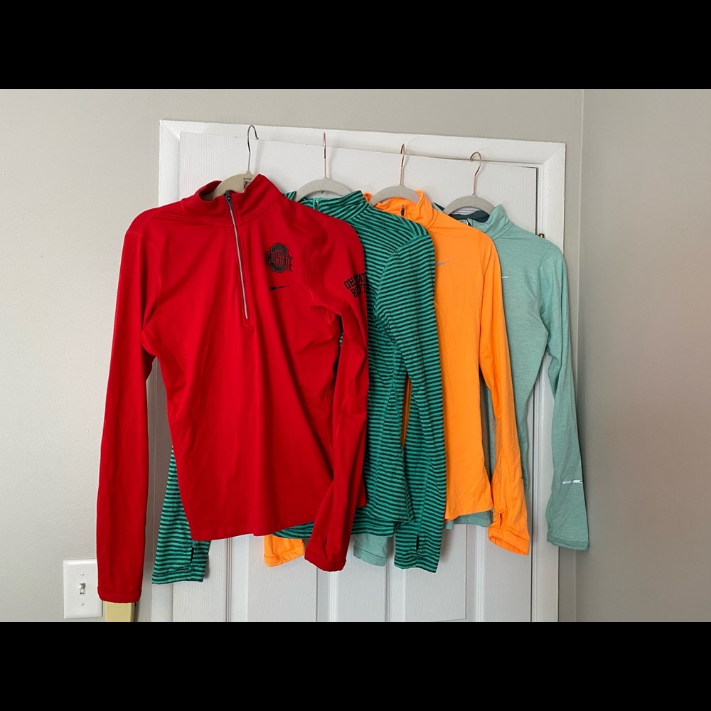 Four Nike dri fit running half zips